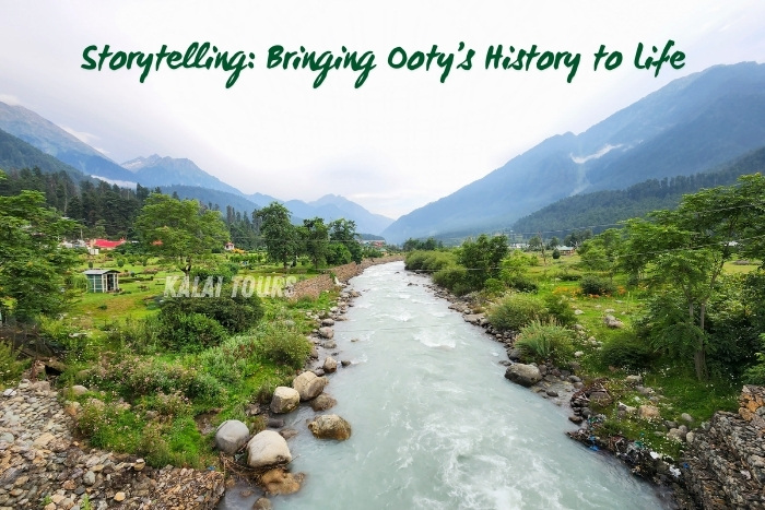 Tranquil river flowing through a lush green valley with misty mountains in the backdrop, capturing Ooty's serene and historic charm. Promoting Kalai Tours in Coonoor, Ooty, for storytelling and guided tours that bring the region's rich history to life. Perfect for travelers exploring the cultural and natural beauty of the Nilgiris